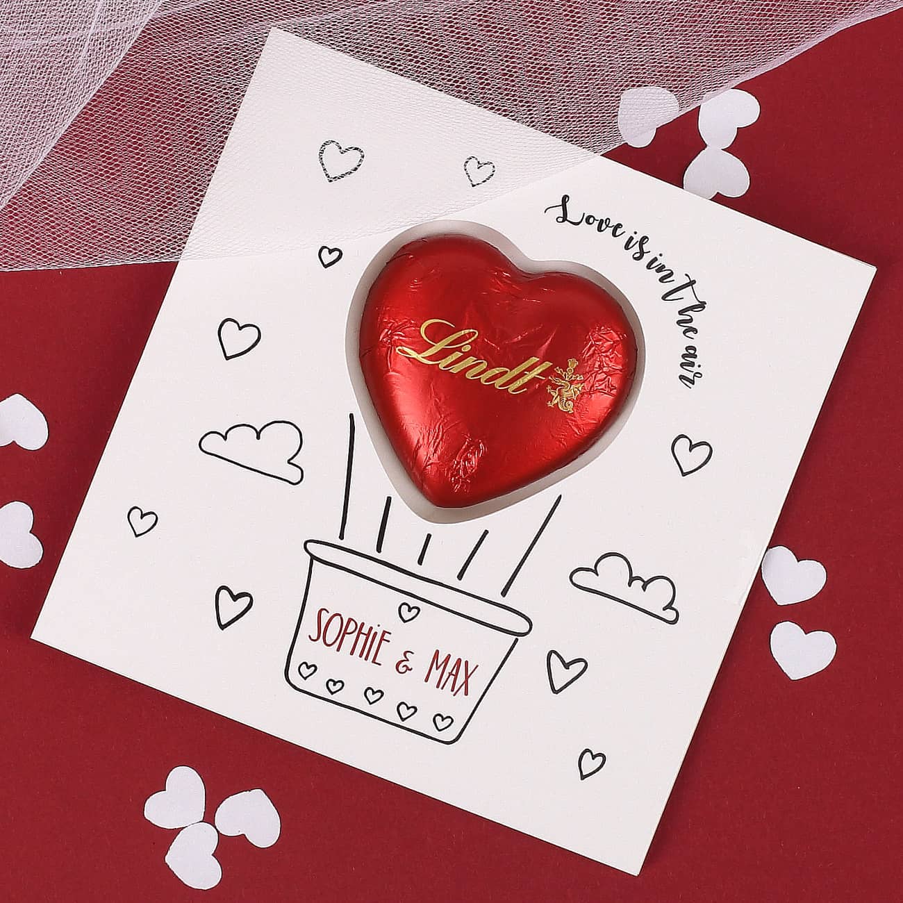 Love is in the air - Klappkarte mit rotem Lindt Schokoherz