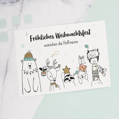 Weihnachtspostkarte mit lustigen Wintertieren und Ihrem Wunschtext