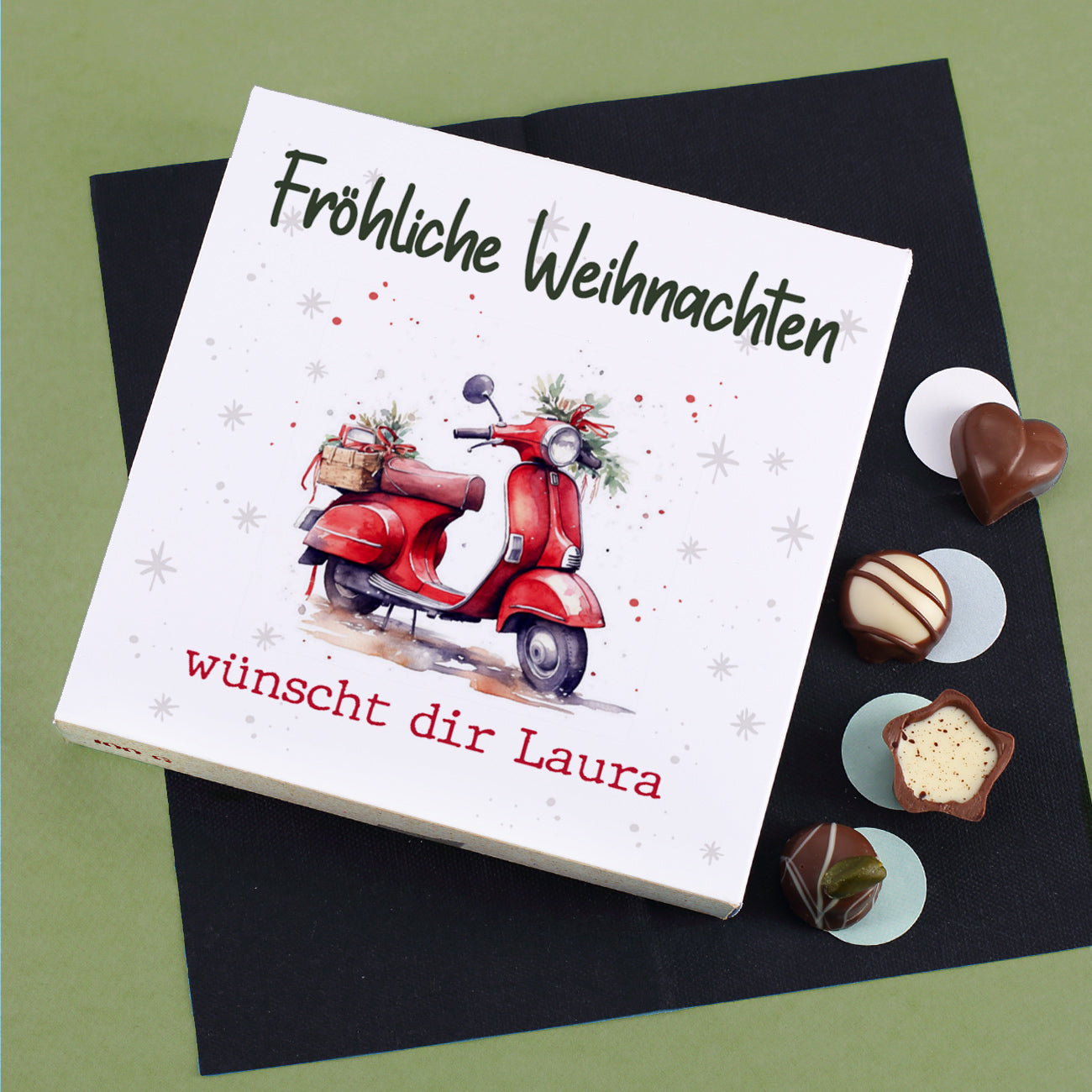 Weihnachts-Pralinés von Lindt und Ihrem Text und weihnachlicher Vespa