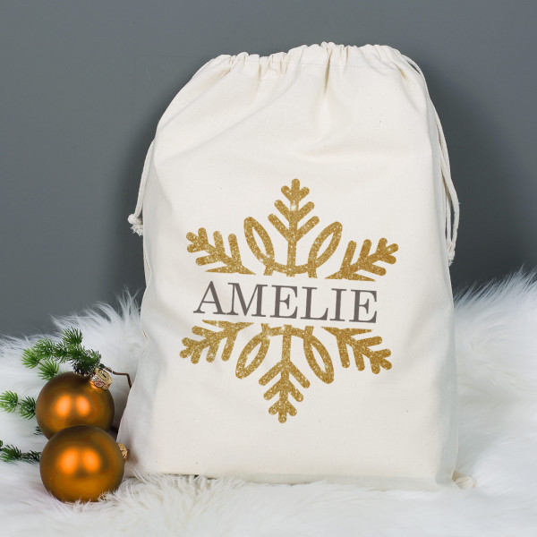 Geschenksack zu Weihnachten mit Schneeflocke in Goldoptik und Name bedruckt